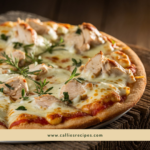 Hot and fresh Chicken Alfredo Pizza with melted cheese stretching as a slice is pulled away